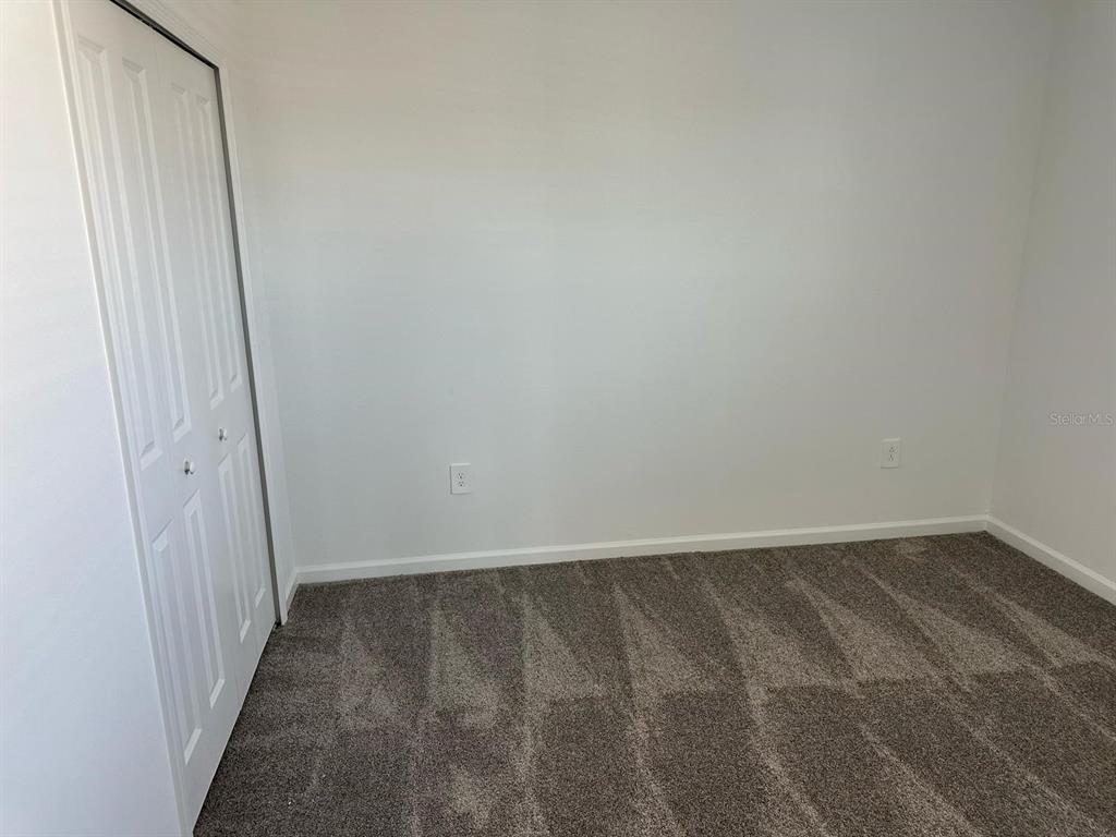 417 Cedar Key Street Davenport, FL 33837 - Photo 7 of 58 a view of an empty room
