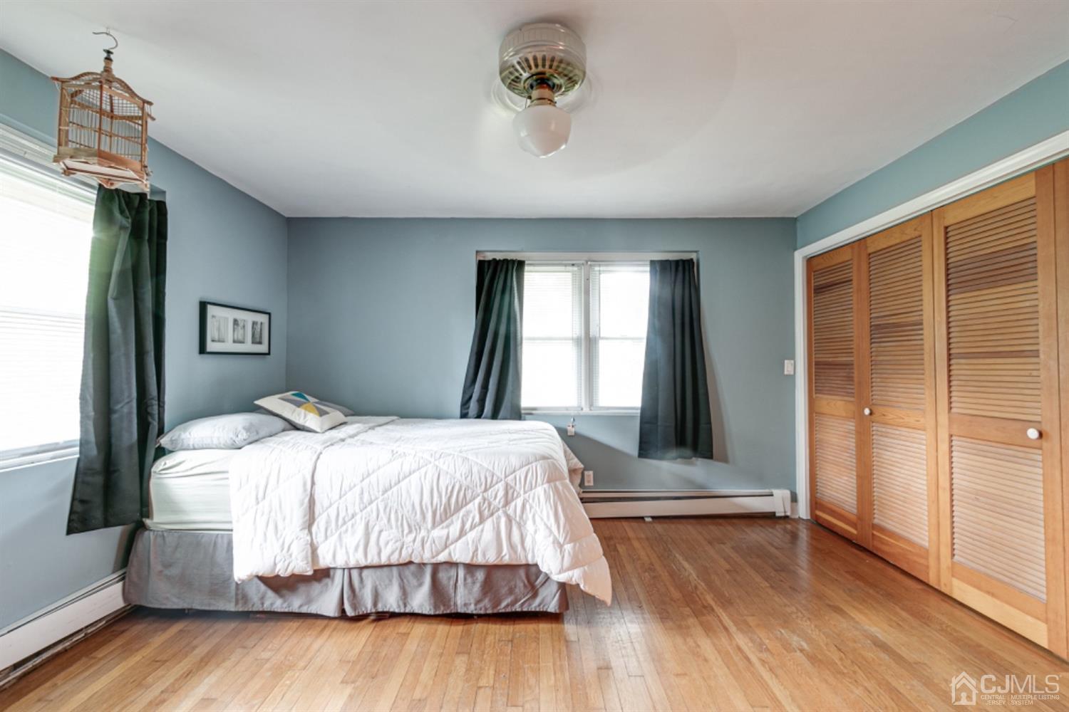 327 Plainfield Road Edison, NJ 08820 - Photo 3 of 19 a bedroom with a bed and wooden floor