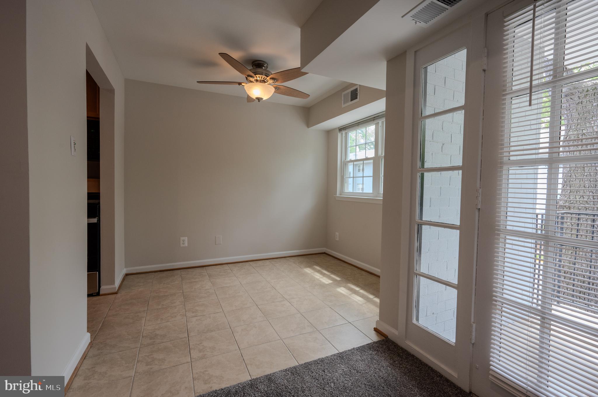 7097 Spring Garden Drive, Unit 101 Springfield, VA 22150 - Photo 7 of 17 a view of an empty room with a window