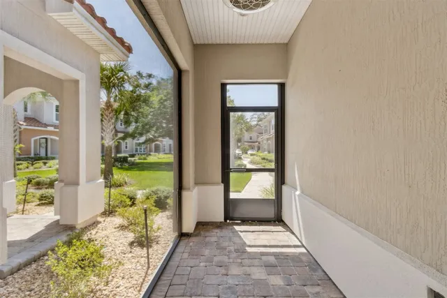 a view of staircase with railing and a potted plant