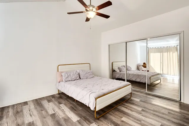 a bedroom with a bed and window