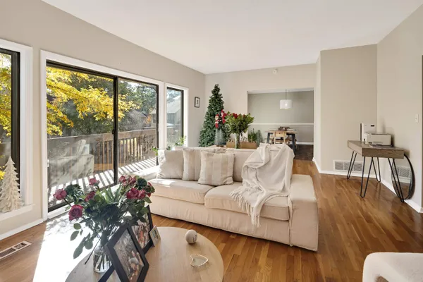 a view of a dining room with furniture window and wooden floor
