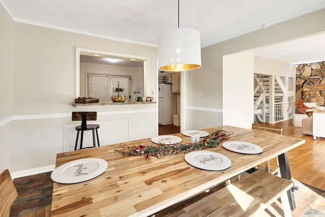a kitchen that has a table and chairs in it