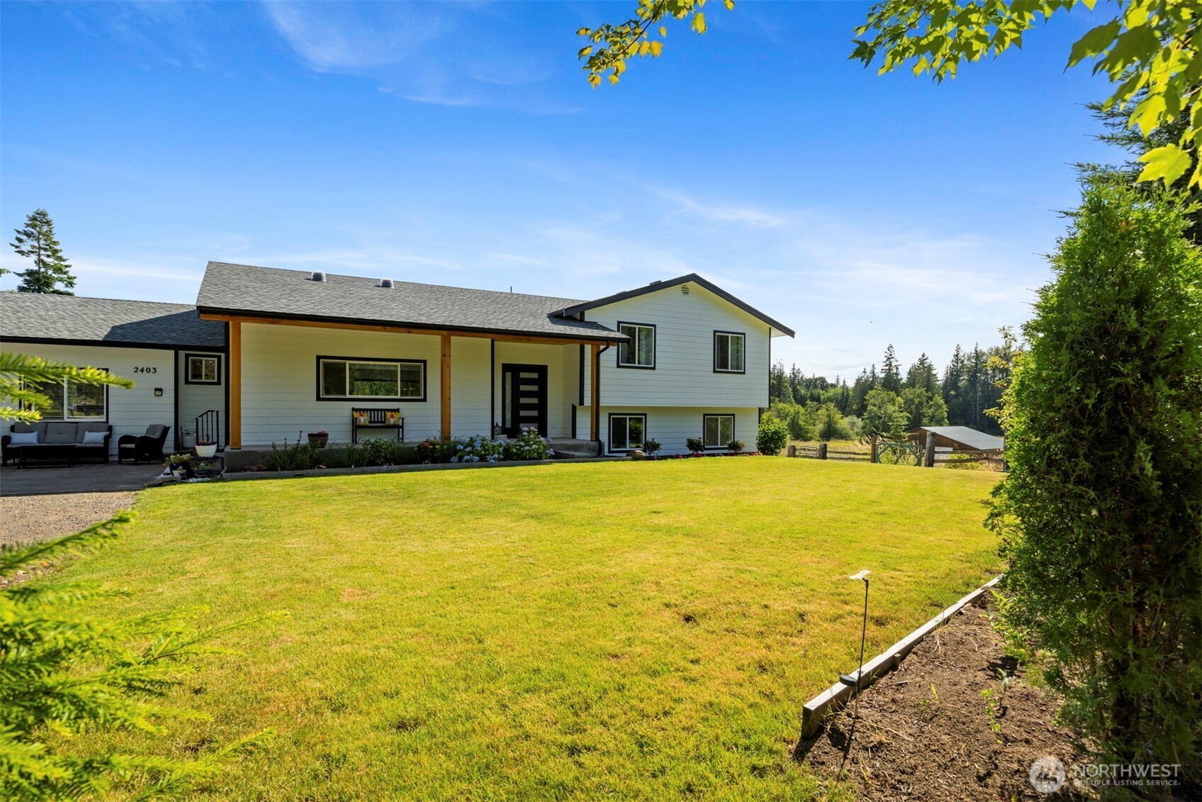 2403 East Hemmi Road Bellingham, WA 98226 - Photo 1 of 40 a view of an house with pool and an outdoor space