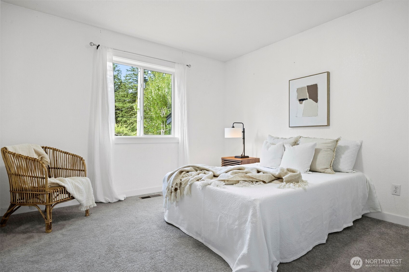 2403 East Hemmi Road Bellingham, WA 98226 - Photo 20 of 40 a bedroom with a bed a chair and next to a window