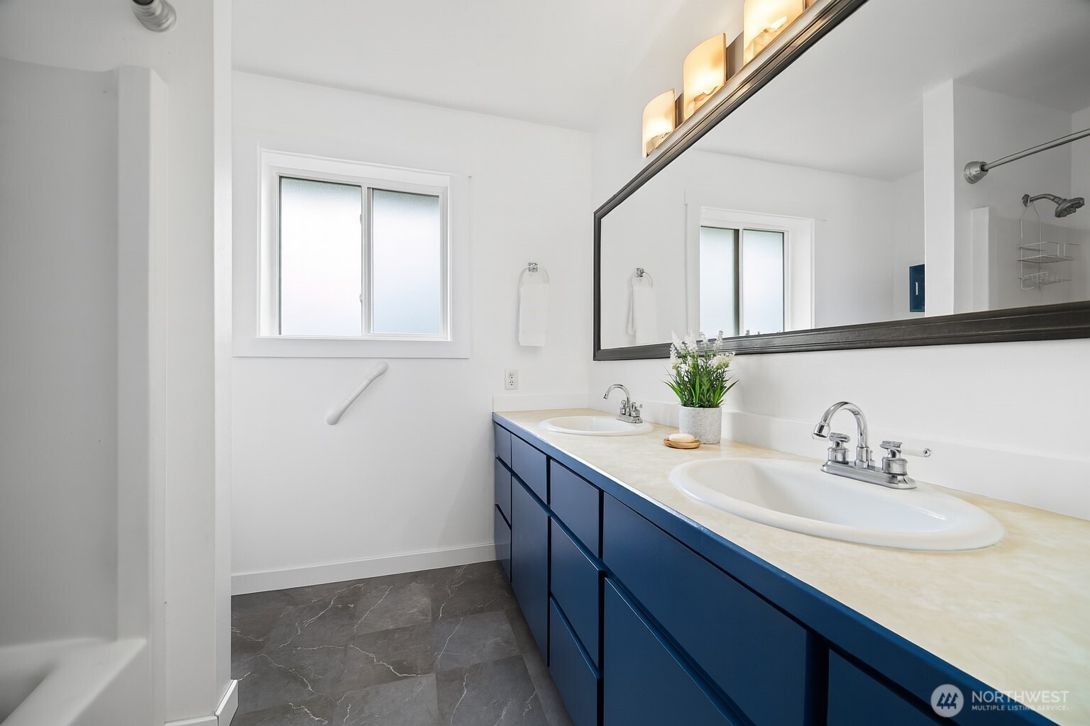 2403 East Hemmi Road Bellingham, WA 98226 - Photo 22 of 40 a bathroom with a sink and a mirror