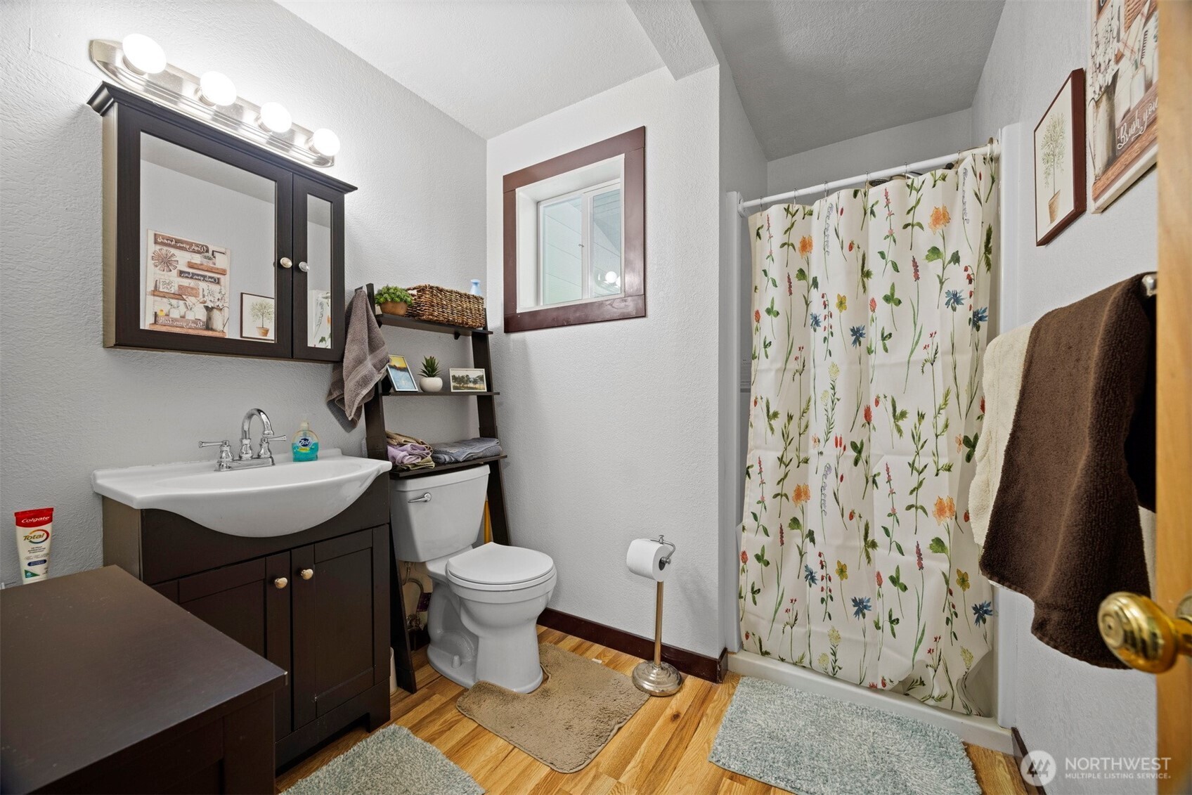 2403 East Hemmi Road Bellingham, WA 98226 - Photo 30 of 40 a bathroom with a toilet sink and mirror