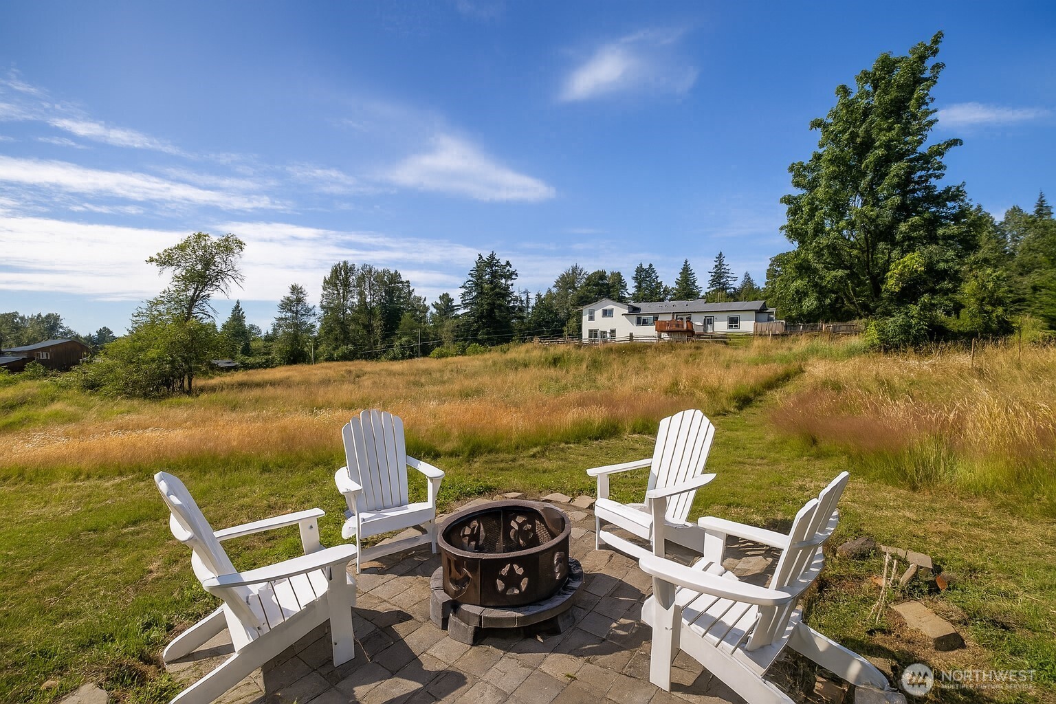 2403 East Hemmi Road Bellingham, WA 98226 - Photo 36 of 40 a view of a lake with couches chairs