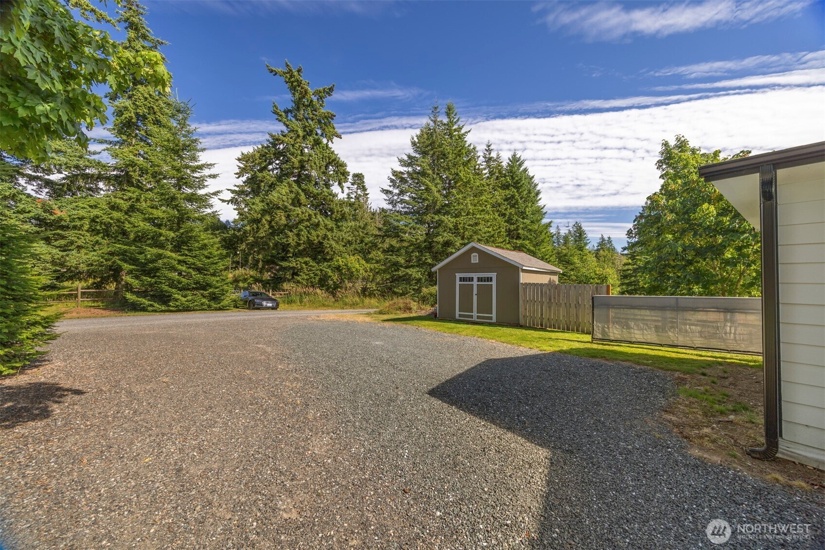 2403 East Hemmi Road Bellingham, WA 98226 - Photo 37 of 40 a front view of a house with a yard and trees