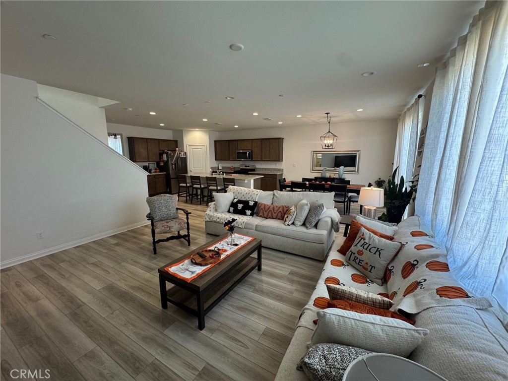 4515 Bandon Avenue Perris, CA 92571 - Photo 12 of 26 a living room with furniture and a wooden floor