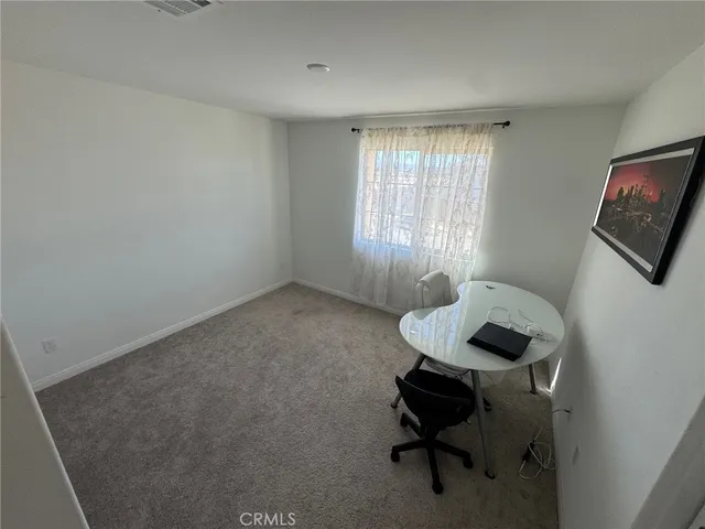 a room with furniture and a window