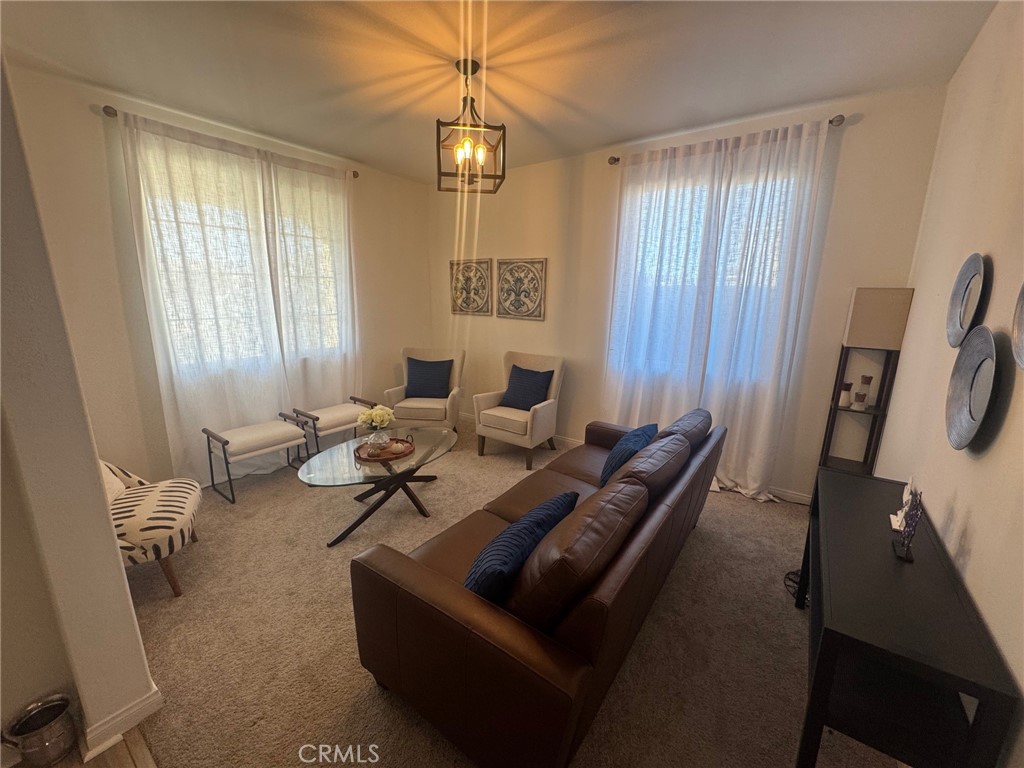 4515 Bandon Avenue Perris, CA 92571 - Photo 4 of 26 a living room with furniture and a window