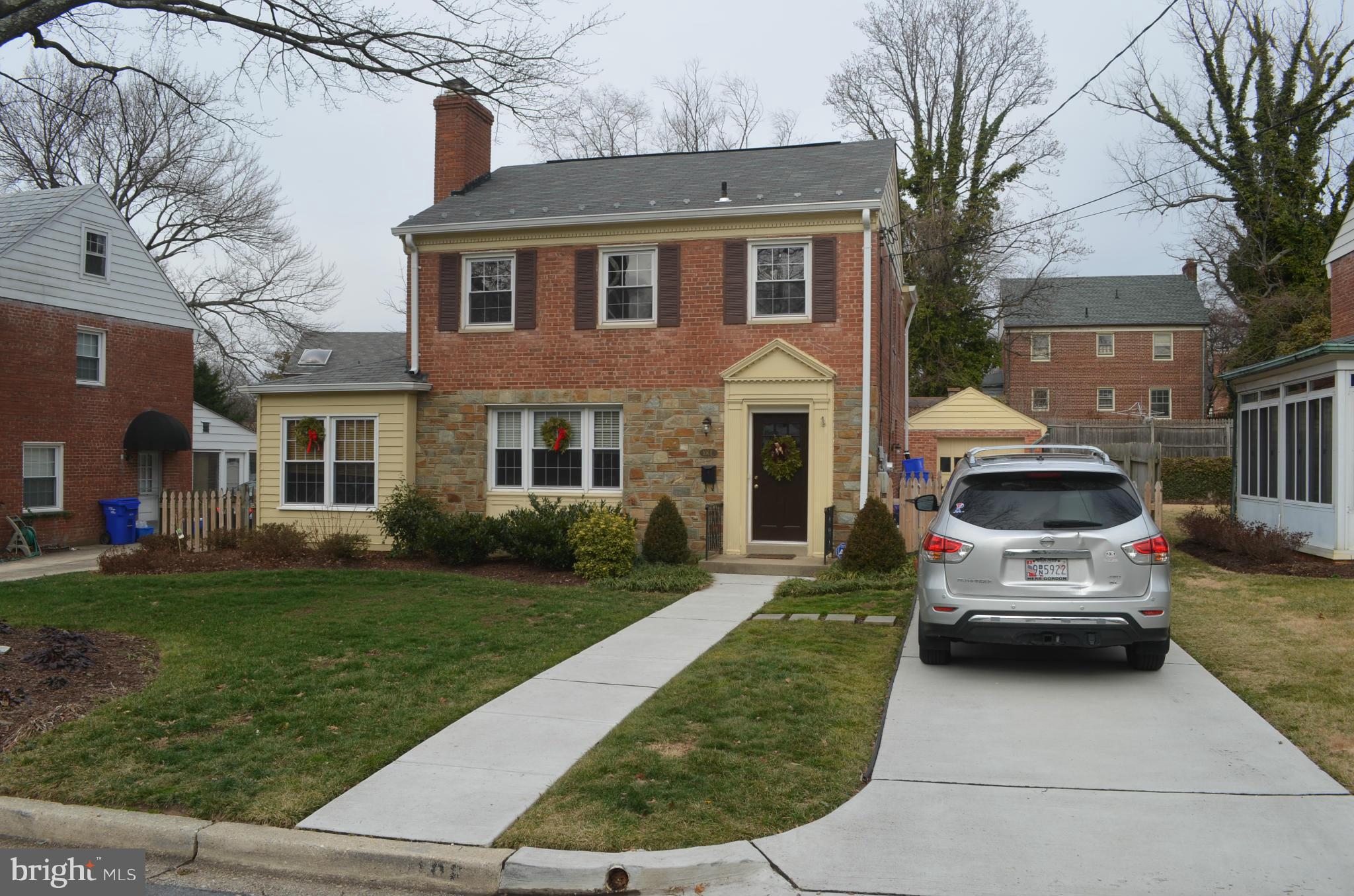106 Indian Spring Drive Silver Spring, MD 20901 - Photo 2 of 30 a front view of a house with a garden