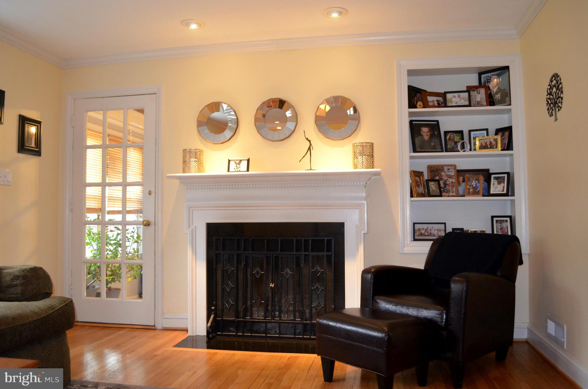 106 Indian Spring Drive Silver Spring, MD 20901 - Photo 12 of 30 a living room with furniture and a fireplace