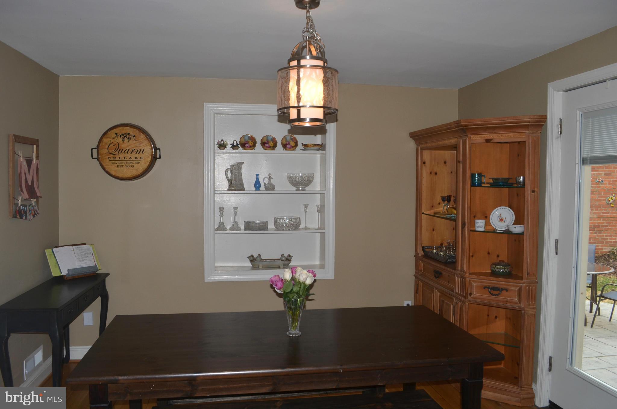106 Indian Spring Drive Silver Spring, MD 20901 - Photo 15 of 30 a view of a dining room with furniture and a window