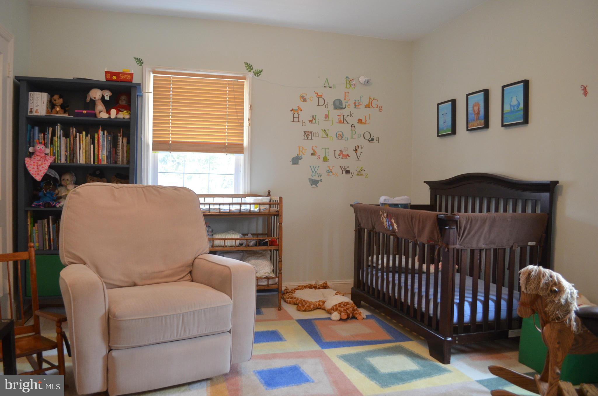 106 Indian Spring Drive Silver Spring, MD 20901 - Photo 24 of 30 a bedroom with furniture and a window