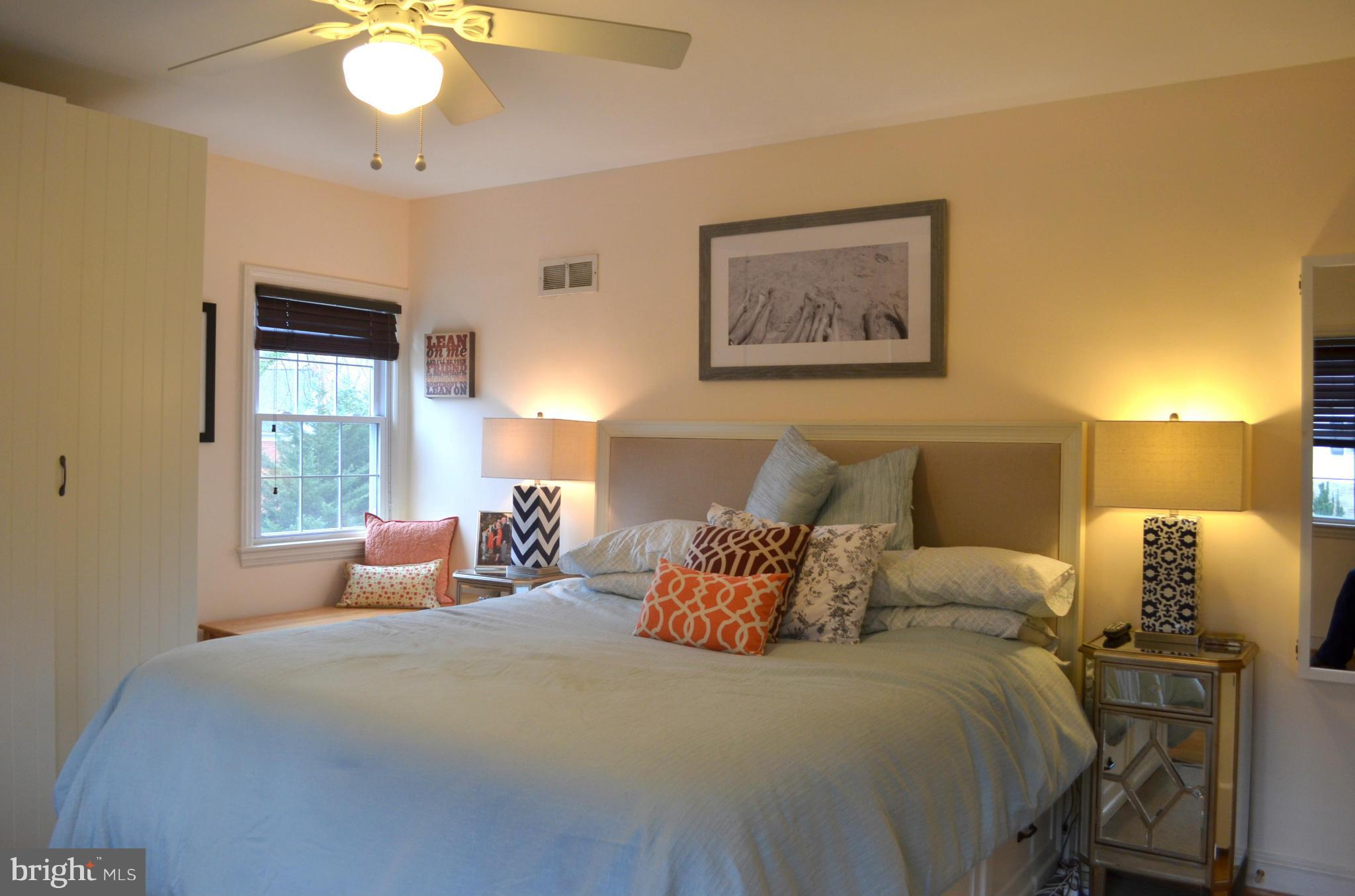 106 Indian Spring Drive Silver Spring, MD 20901 - Photo 26 of 30 a bedroom with bed and window with furniture
