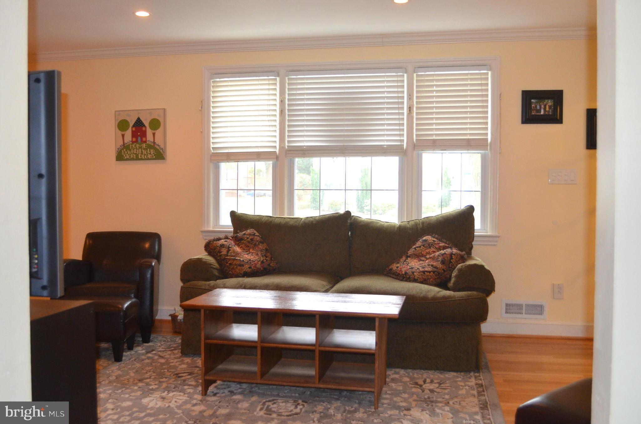 106 Indian Spring Drive Silver Spring, MD 20901 - Photo 10 of 30 a living room with furniture and a window