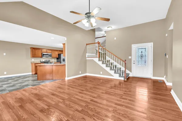 a view of a kitchen with a sink hardwood floor and a kitchen