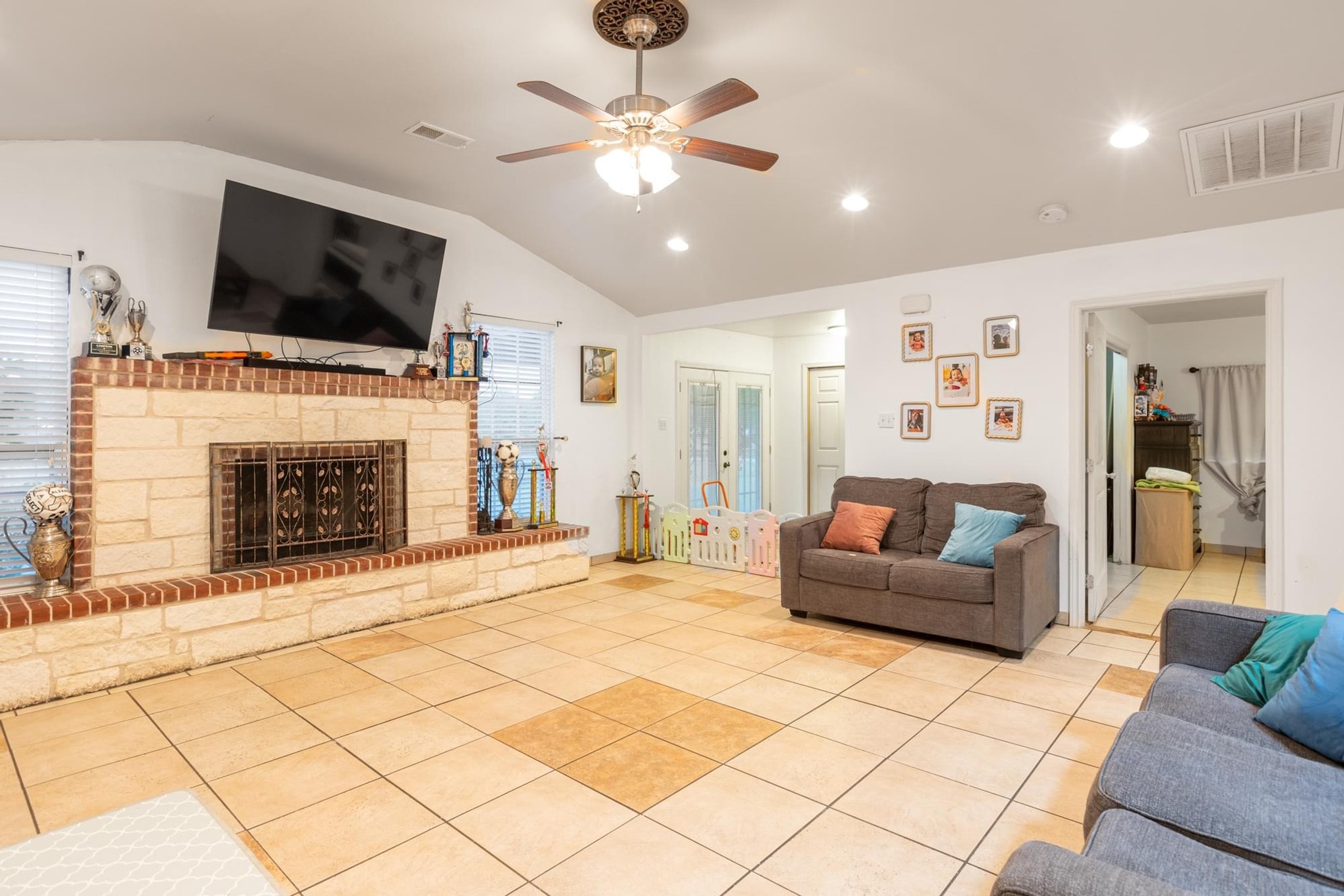 176 Old Lexington Road, Unit C Elgin, TX 78621 - Photo 6 of 31 a living room with furniture and a flat screen tv