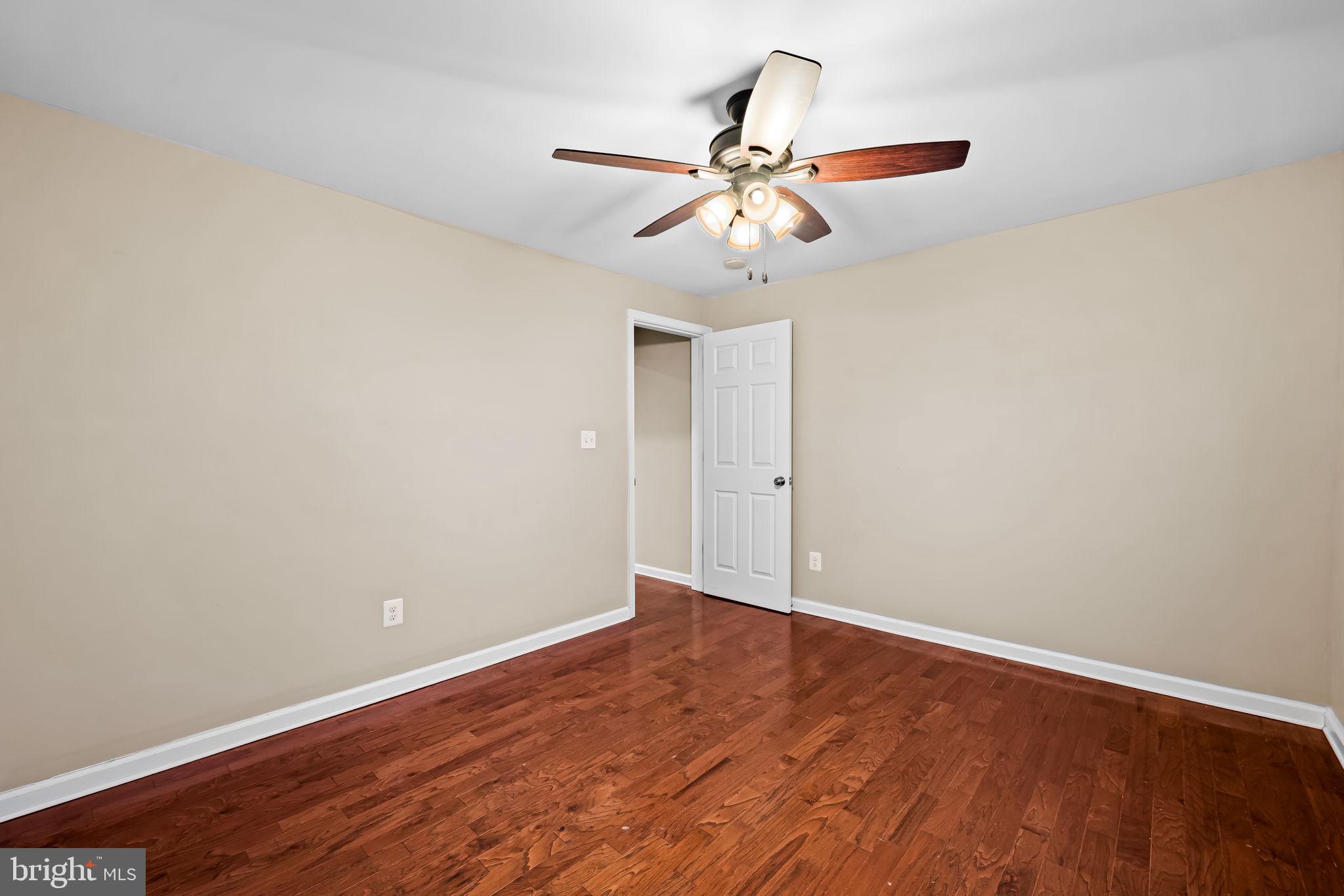 1817 Dunmere Road Baltimore, MD 21222 - Photo 15 of 27 a view of an empty room with wooden floor
