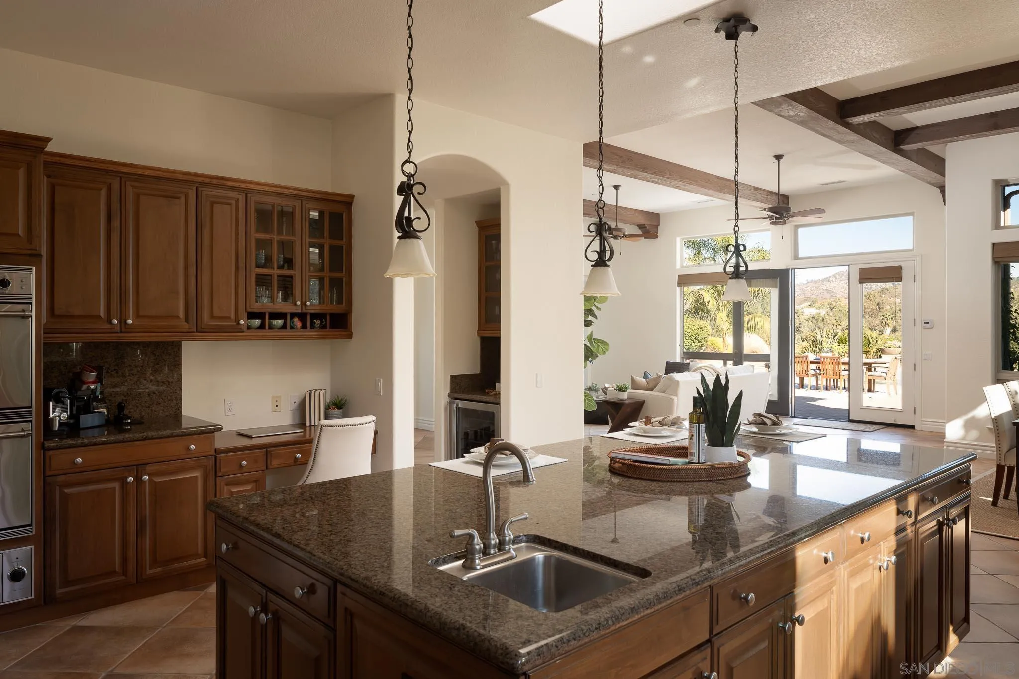 14014 Lake Poway Road Poway, CA 92064 - Photo 13 of 55 a kitchen with stainless steel appliances granite countertop a sink a stove and refrigerator