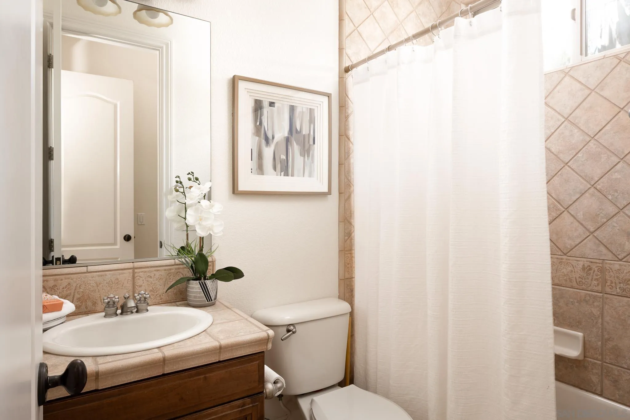 14014 Lake Poway Road Poway, CA 92064 - Photo 19 of 55 a bathroom with a sink mirror and toilet