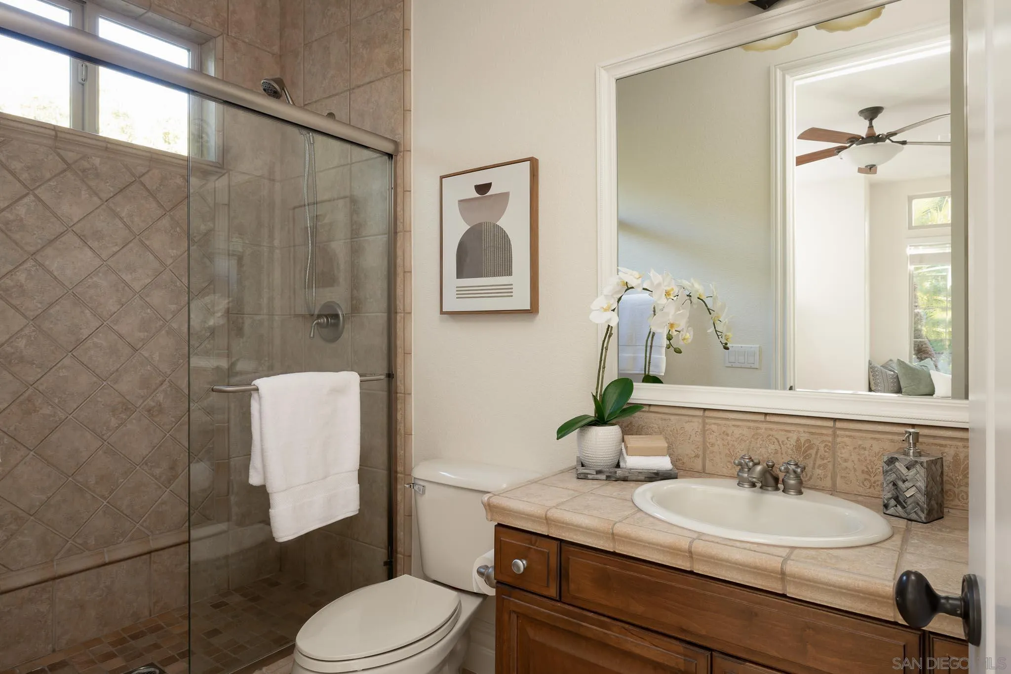 14014 Lake Poway Road Poway, CA 92064 - Photo 30 of 55 a bathroom with a granite countertop toilet sink and mirror