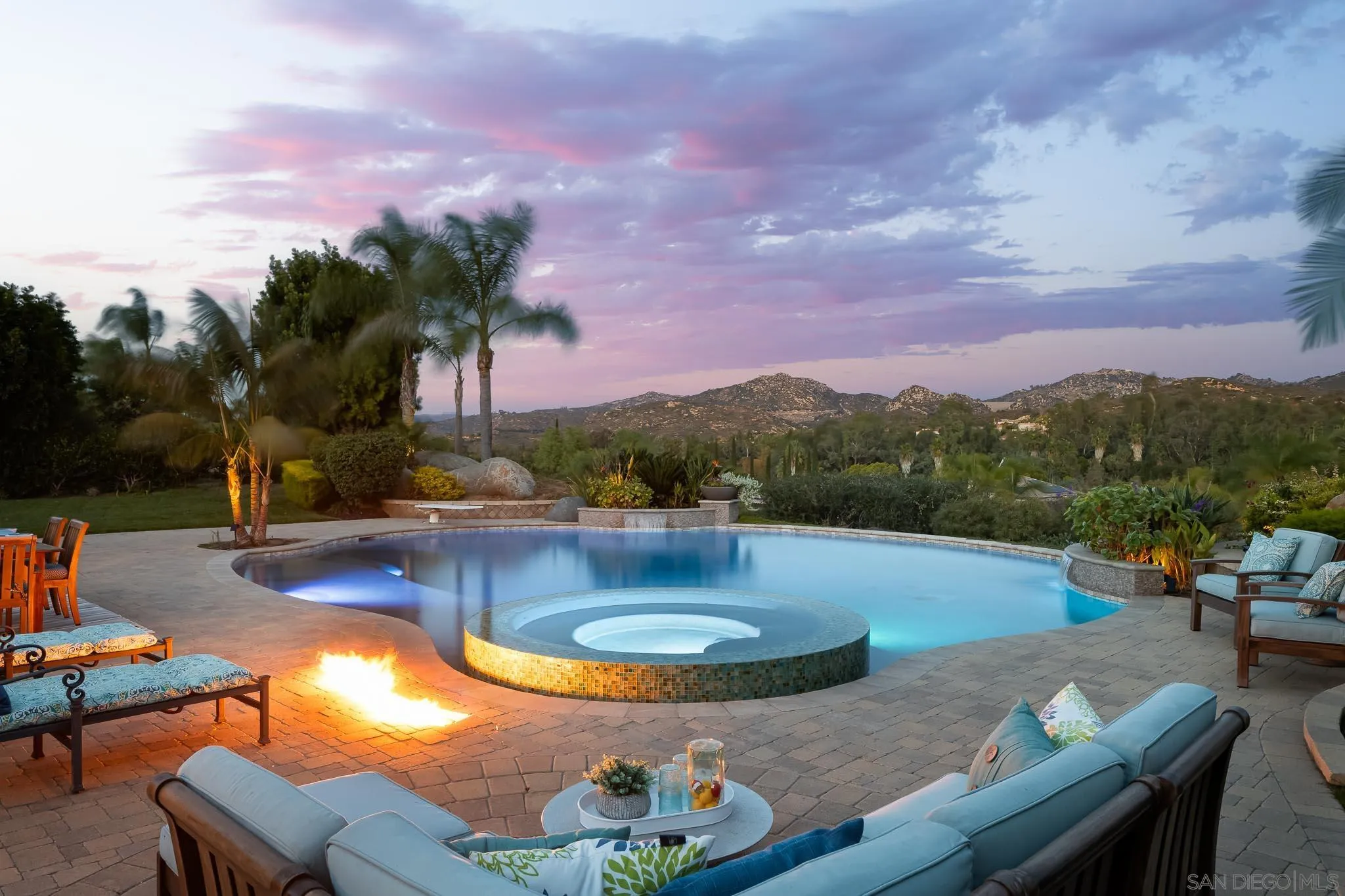 14014 Lake Poway Road Poway, CA 92064 - Photo 35 of 55 a view of a swimming pool with a table and chairs
