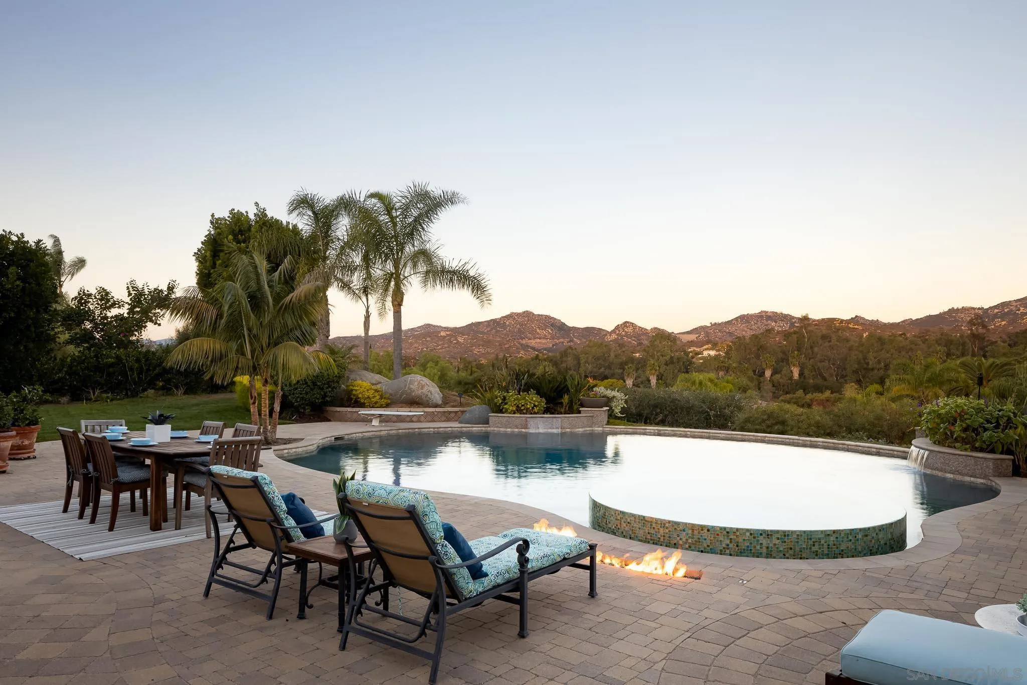 14014 Lake Poway Road Poway, CA 92064 - Photo 38 of 55 a view of a lake with a table and chairs