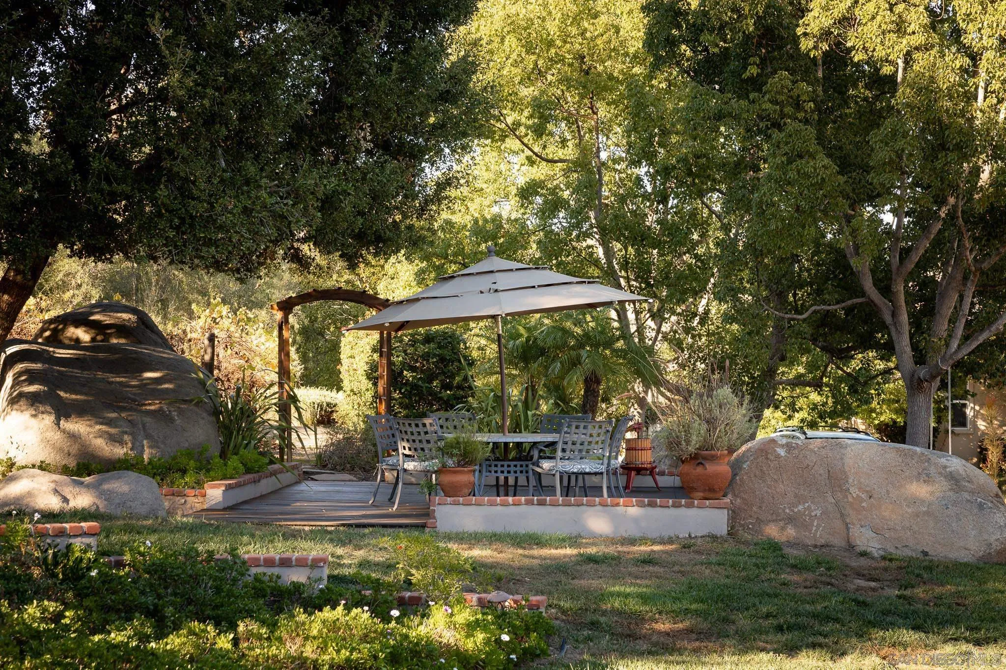 14014 Lake Poway Road Poway, CA 92064 - Photo 42 of 55 a view of a swimming pool with a patio