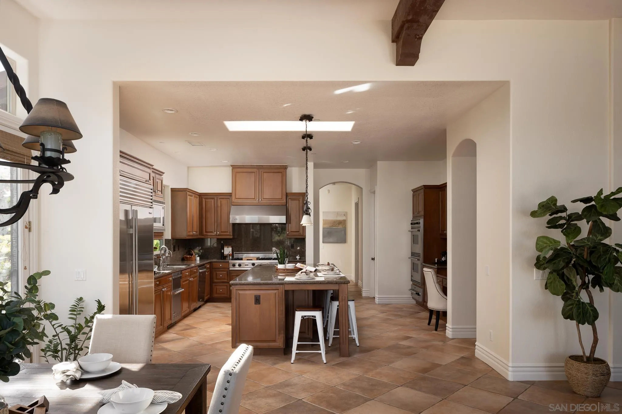 14014 Lake Poway Road Poway, CA 92064 - Photo 10 of 55 a kitchen with stainless steel appliances kitchen island granite countertop a refrigerator and a sink