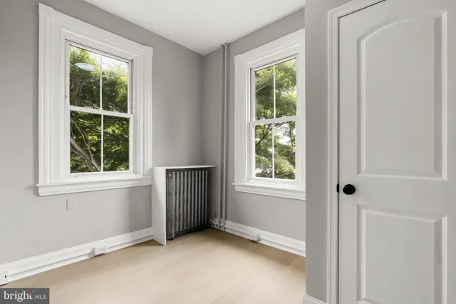 an empty room with windows