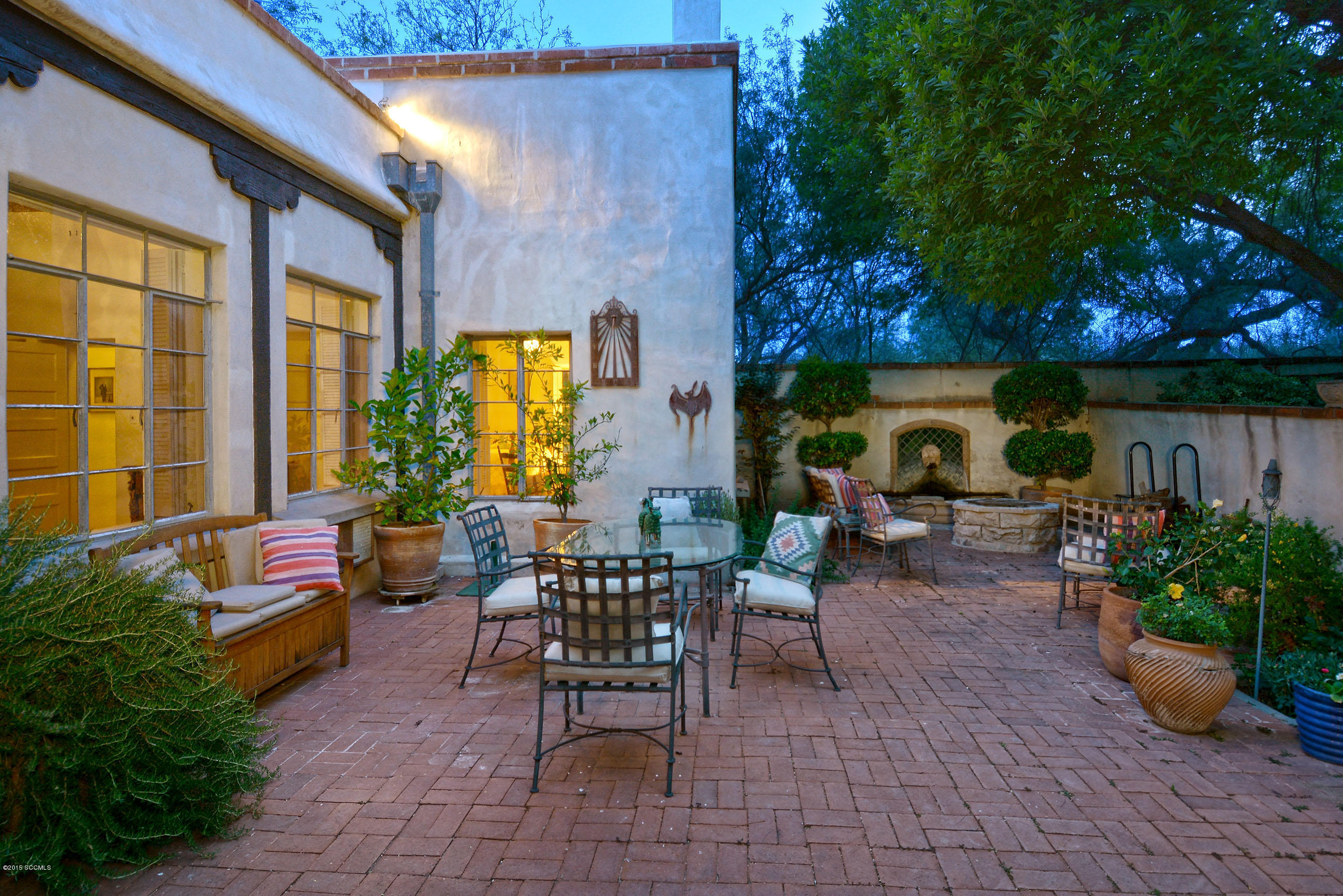 87 Clark Crossing Road Rio Rico, AZ 85648 - Photo 18 of 51 a view of a patio with chairs and potted plants