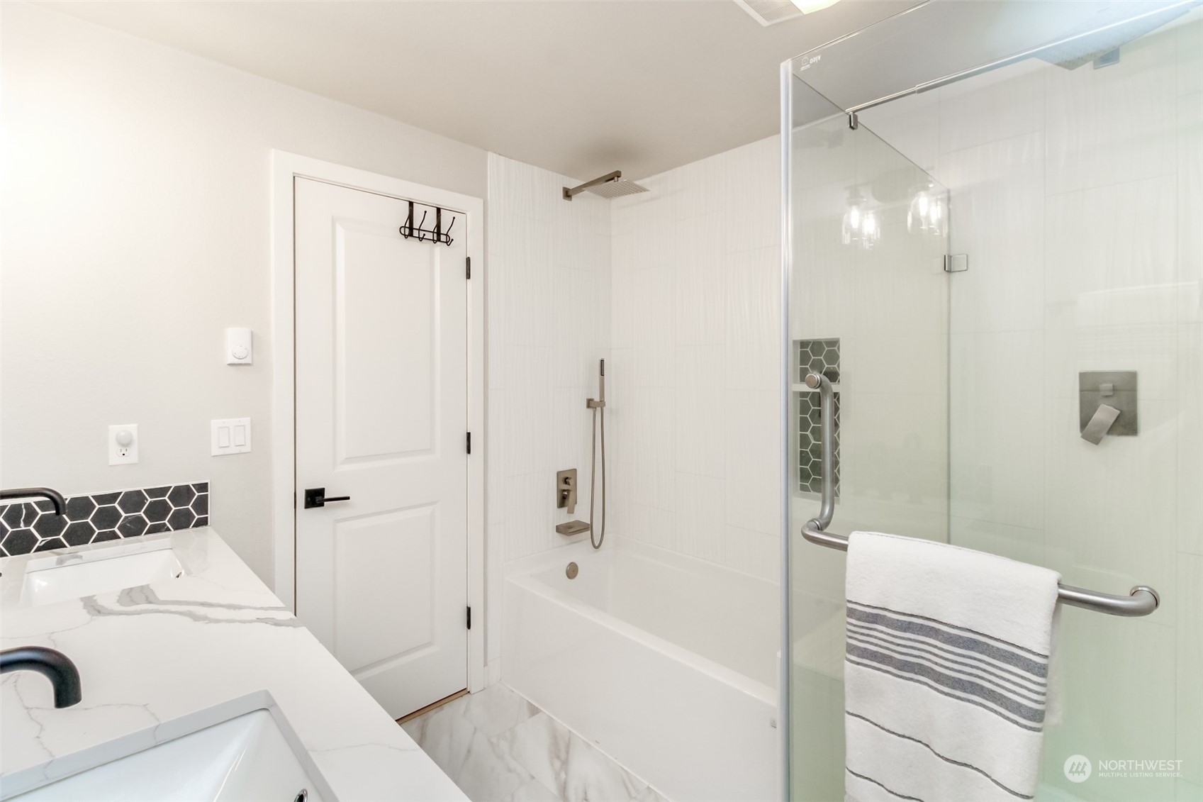 3017 Forest Rim Court South Puyallup, WA 98374 - Photo 16 of 40 a bathroom with a sink a toilet and shower