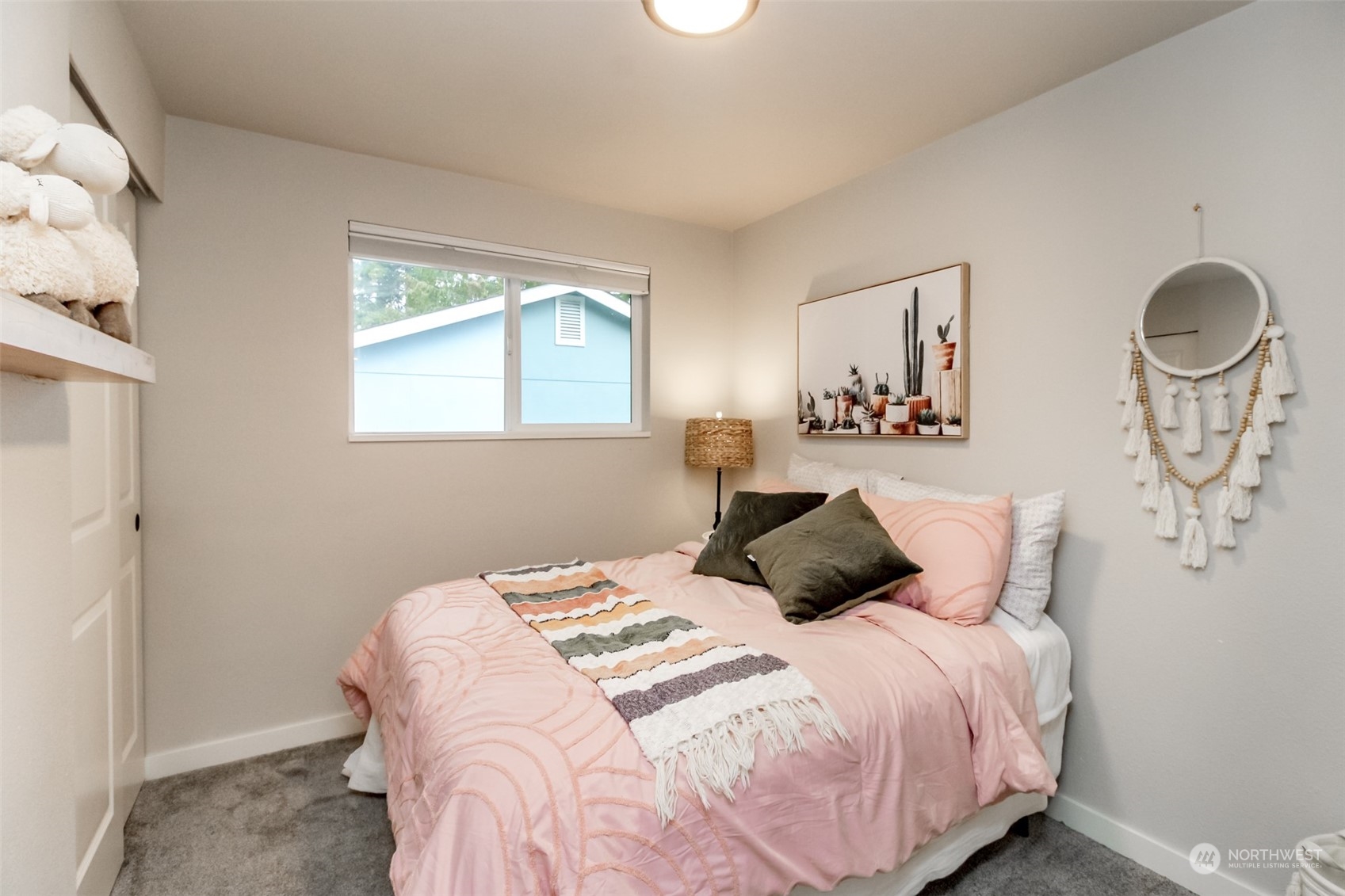 3017 Forest Rim Court South Puyallup, WA 98374 - Photo 17 of 40 a bedroom with a bed and window