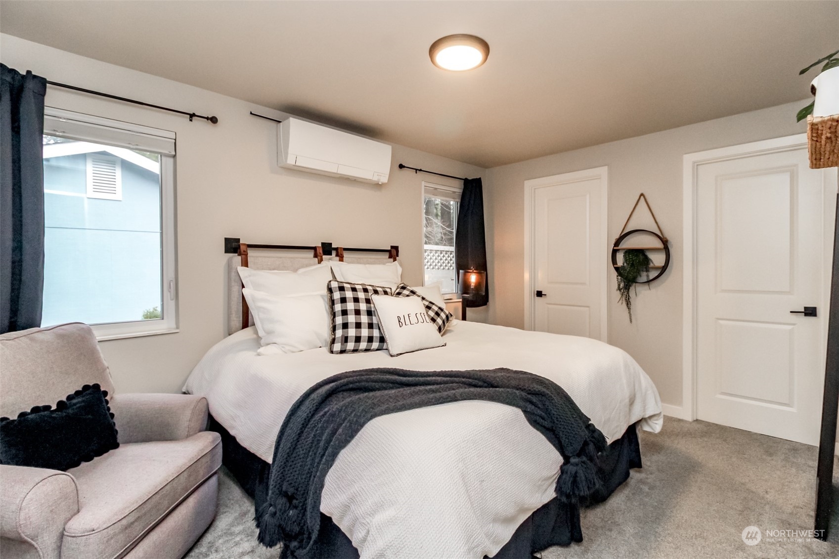 3017 Forest Rim Court South Puyallup, WA 98374 - Photo 19 of 40 a bedroom with bed and a window