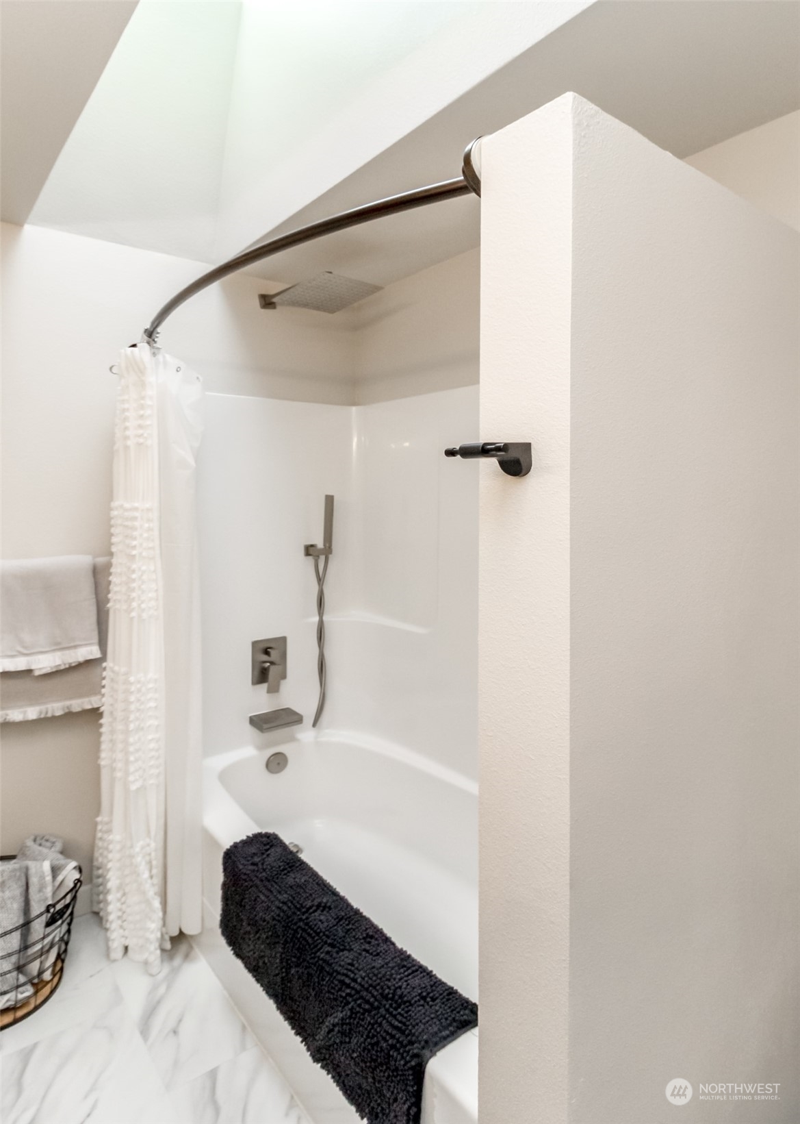 3017 Forest Rim Court South Puyallup, WA 98374 - Photo 22 of 40 a bathroom with a bathtub and shower