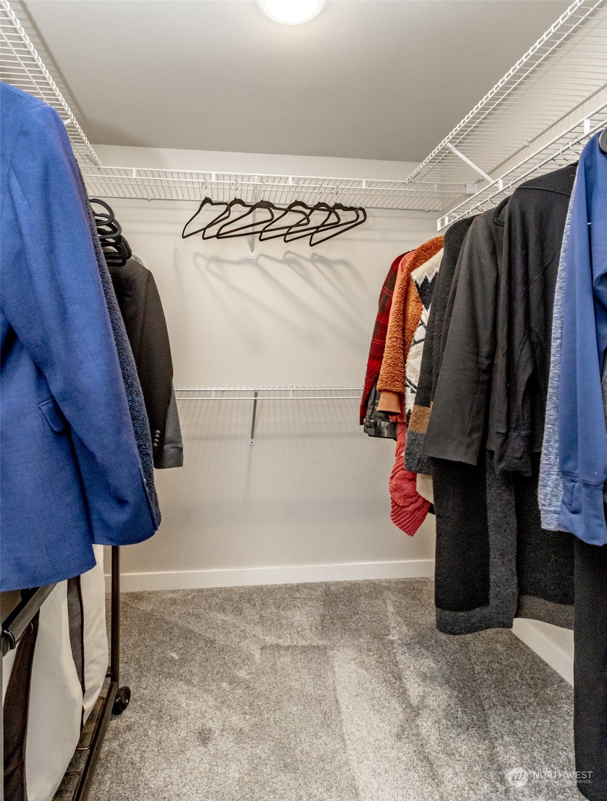 3017 Forest Rim Court South Puyallup, WA 98374 - Photo 23 of 40 a view of walk in closet with clothes and shoes