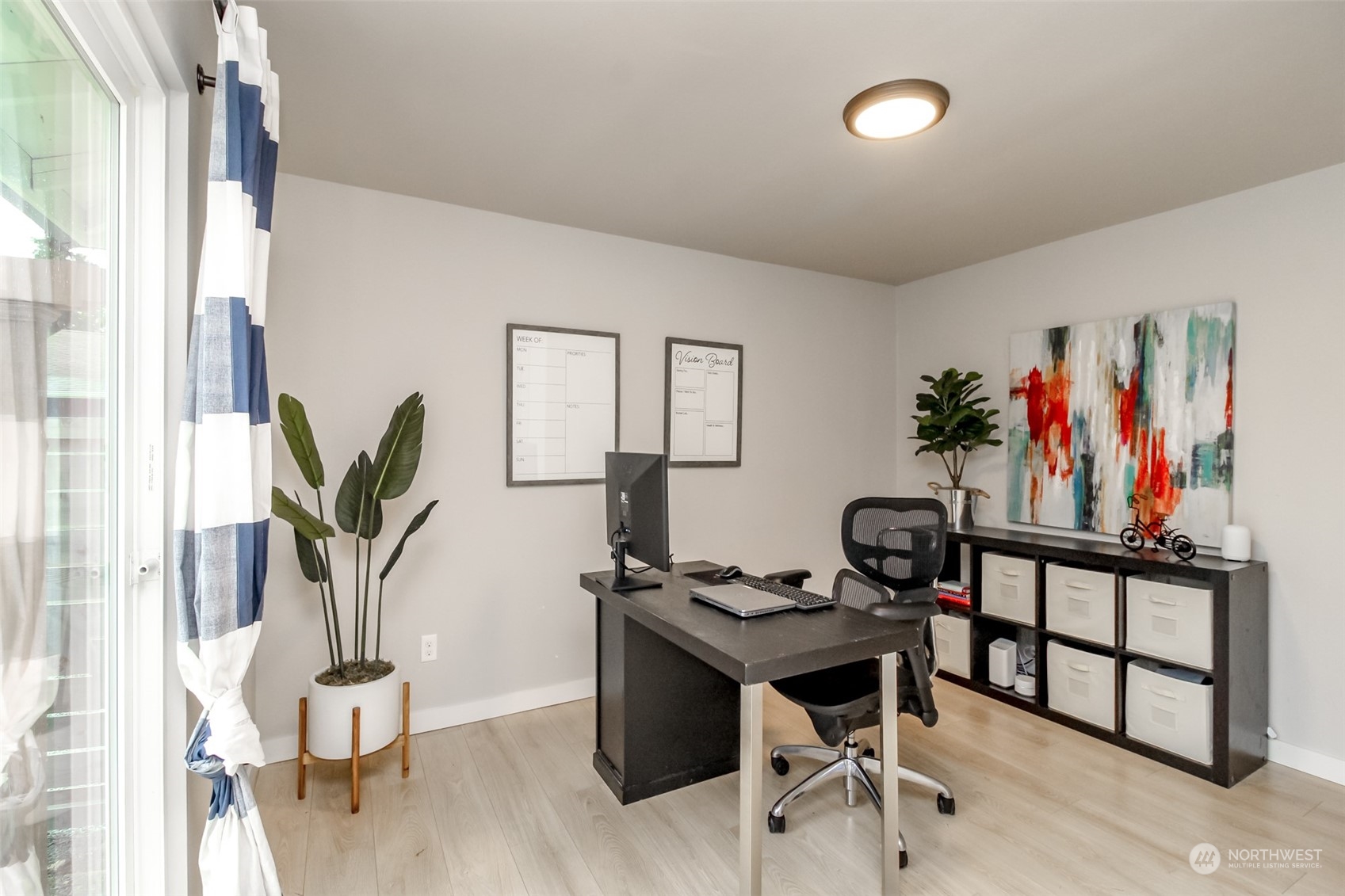 3017 Forest Rim Court South Puyallup, WA 98374 - Photo 26 of 40 a view of a workspace with furniture and wooden floor