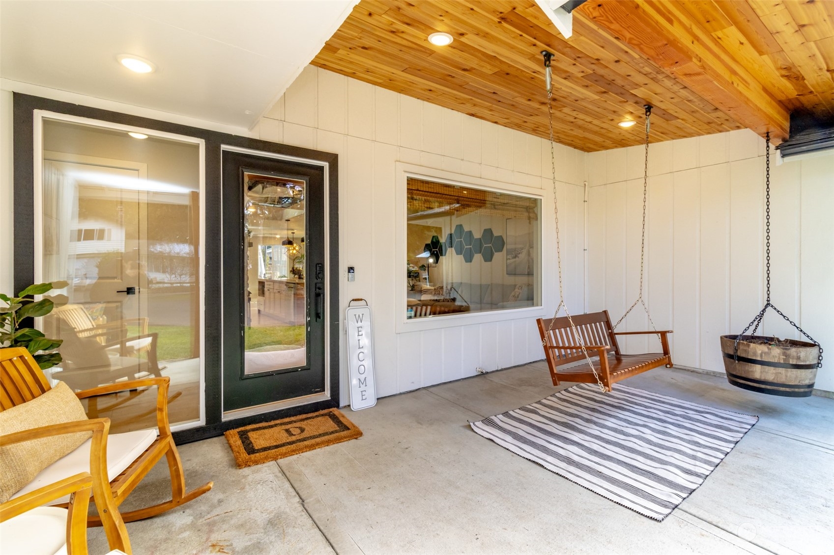 3017 Forest Rim Court South Puyallup, WA 98374 - Photo 29 of 40 a living room with furniture a flat screen tv and a table