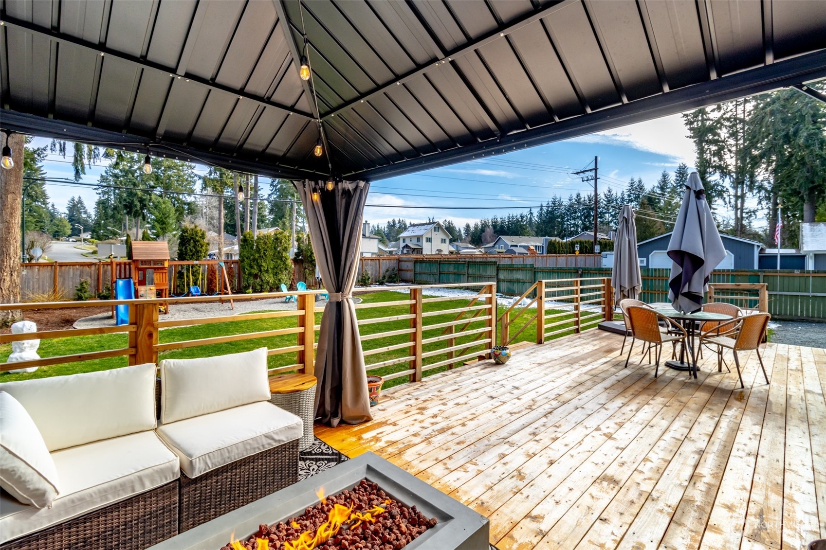 3017 Forest Rim Court South Puyallup, WA 98374 - Photo 30 of 40 a view of a patio with a table chairs and a patio
