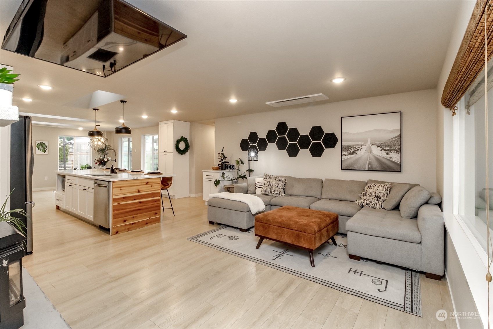 3017 Forest Rim Court South Puyallup, WA 98374 - Photo 3 of 40 a living room with furniture kitchen view and a chandelier
