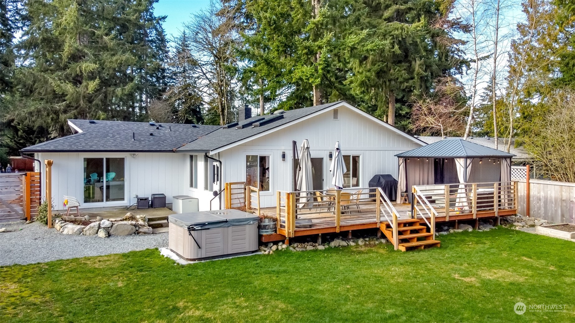 3017 Forest Rim Court South Puyallup, WA 98374 - Photo 31 of 40 a view of a white house with a big yard and large trees