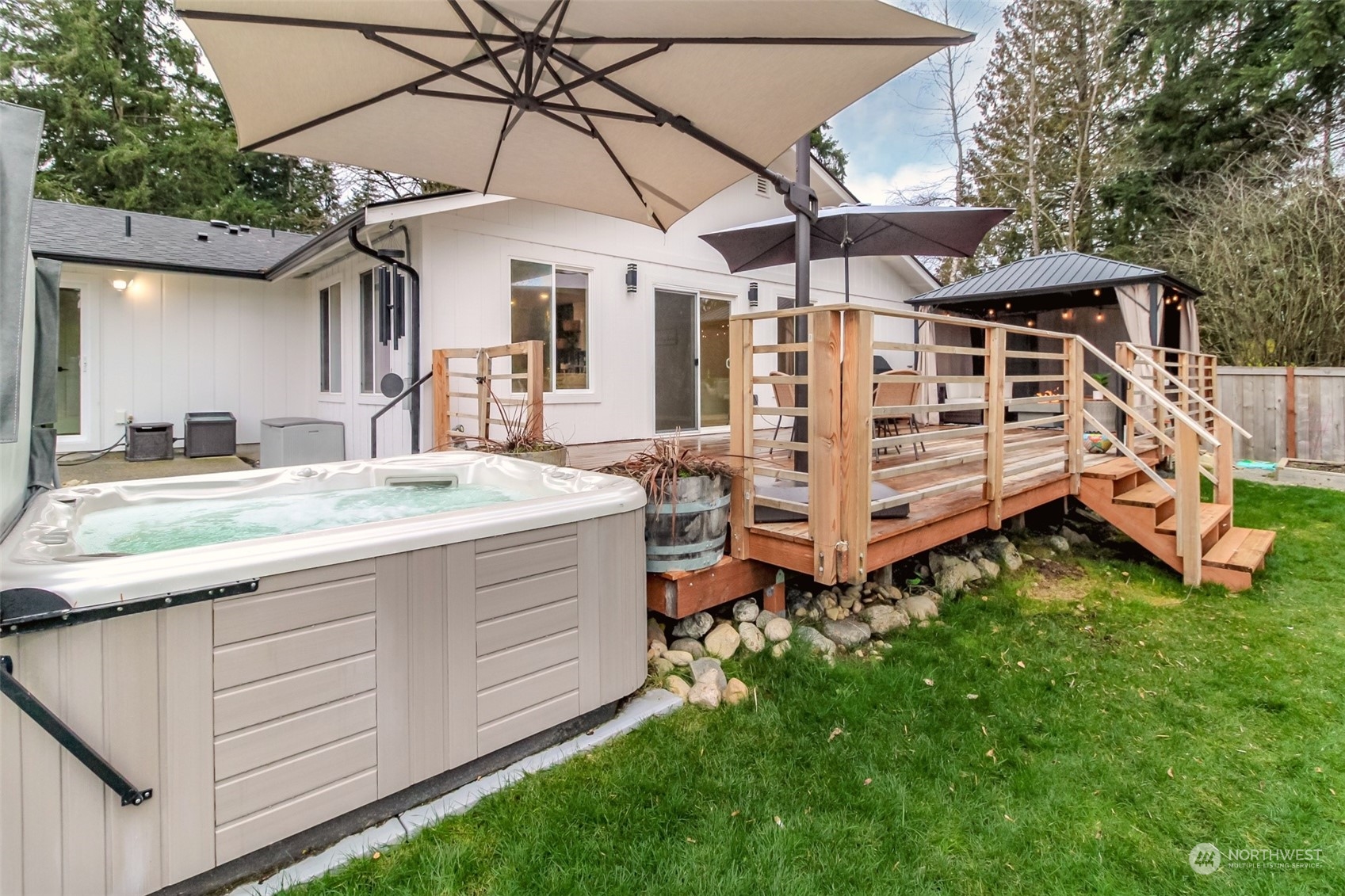 3017 Forest Rim Court South Puyallup, WA 98374 - Photo 35 of 40 a view of a house with a yard and wooden deck