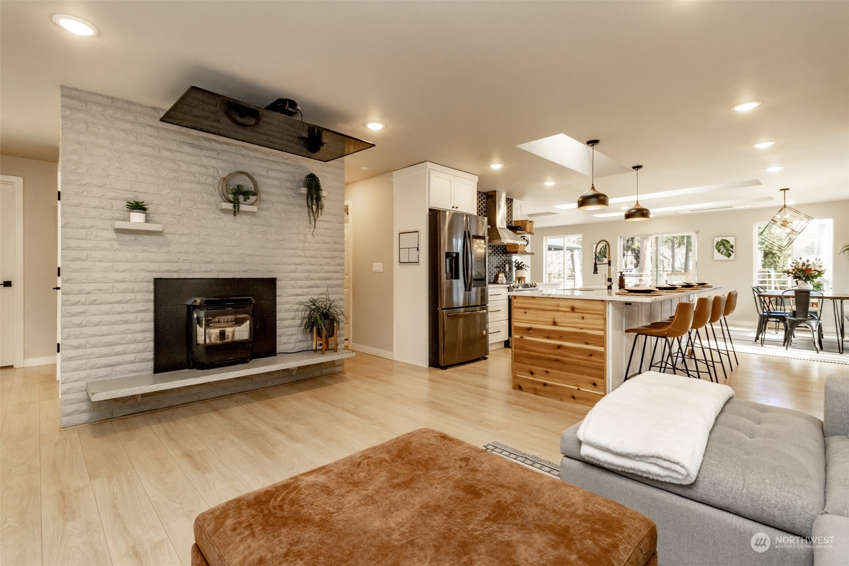 3017 Forest Rim Court South Puyallup, WA 98374 - Photo 4 of 40 a living room with furniture and a fireplace