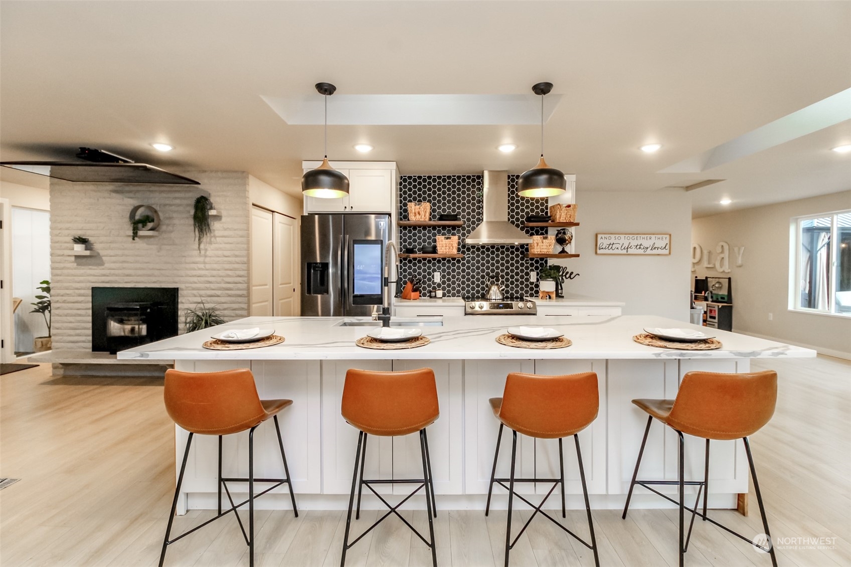 3017 Forest Rim Court South Puyallup, WA 98374 - Photo 5 of 40 a kitchen with cabinets and a table