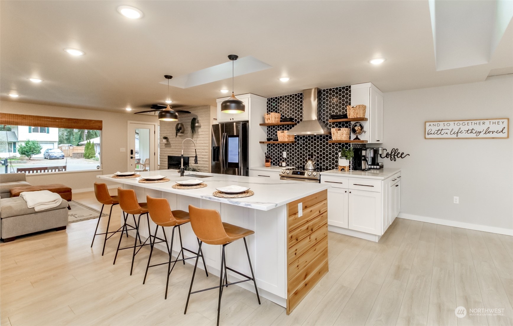 3017 Forest Rim Court South Puyallup, WA 98374 - Photo 7 of 40 a large kitchen with a table and chairs