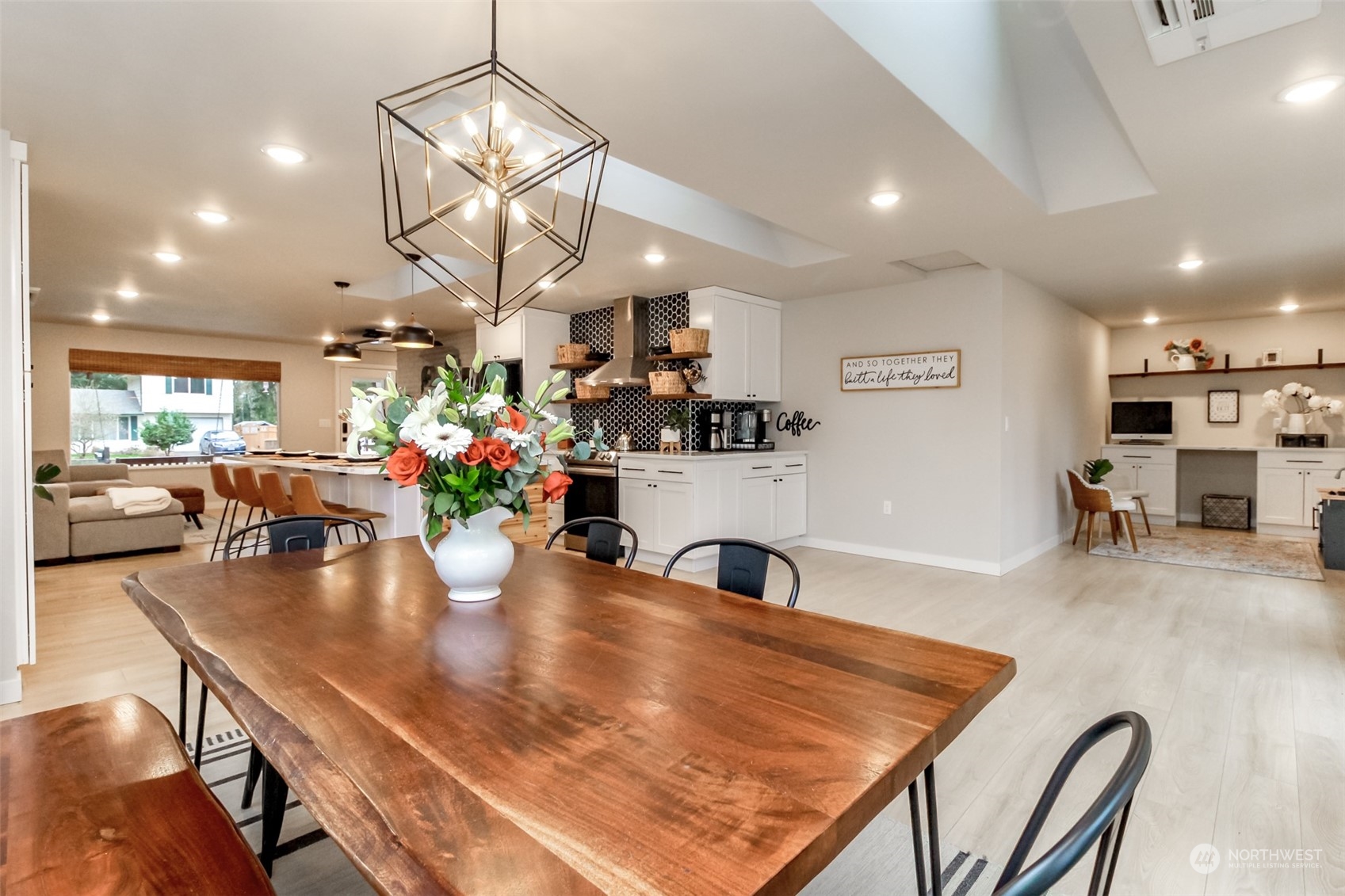 3017 Forest Rim Court South Puyallup, WA 98374 - Photo 8 of 40 a room with stainless steel appliances lots of wooden furniture dining table and chairs