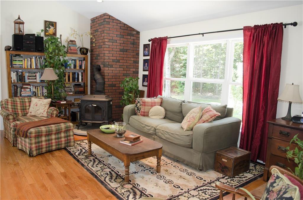 181 Bagaduce Road Holden, ME 04429 - Photo 7 of 31 Living room has wood stove for an...